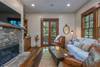 Custom stone, wood burning fireplace and flat screen TV.