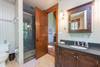 Master suite with walk-in shower and soaking tub.
