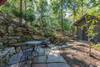 Lower patio with table (seating for 3) and fire pit.