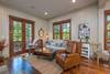 Living area with french doors leading out to wrap around deck.