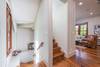 Staircase leading up to Master suite and downstairs to queen bed