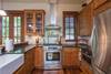 Fully equipped kitchen with gas range.