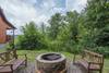 Fire pit in side yard of the cabin