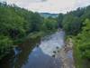 River located at the bottom of the mountain accessible to renter