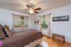 Main level bedroom with king bed
