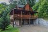 Large covered deck and large parking area.