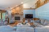 Main level living room w/ 65" TV and gas fireplace.