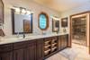 Master bathroom w/ walk-in shower and double vanity.