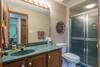 Lower level (level 1) hall bath w/ walk-in shower only.