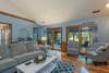 Main level living room w/ doors out to sun room.