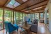Sun room w/ floor to ceiling windows (no heating).