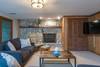 Lower level (Level 1) den w/ doors out to screen porch and patio