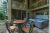 Lower level patio w/ bistro table and 8 person hot tub.