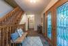 Main level hallway w/ stairs up to loft & down to level 2.