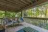 Covered porch on level 2 overlooking creek and golf course.