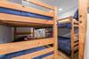 Den on lower level w/ 3 sets of bunk beds.