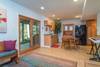 Lower level kitchenette w/ doors out to patio.