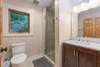 Apartment bathroom w/ walk-in shower.