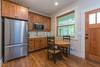 Apartment entrance and kitchenette.