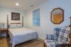 Bedroom on lower level w/ double bed.