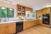Kitchen w/ dishwasher and coffee maker.