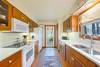 FULLY EQUIPPED KITCHEN NEXT TO ACCESS TO BACKYARD AND PORCH FULLY EQUIPPED KITCHEN NEXT TO ACCESS TO BACKYARD AND PORCH