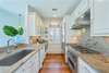KITCHEN WITH ALL STAINLESS STEEL APPLIANCES THROUGHOUT