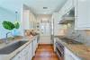 KITCHEN WITH ALL STAINLESS STEEL APPLIANCES THROUGHOUT KITCHEN WITH ALL STAINLESS STEEL APPLIANCES THROUGHOUT