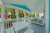 OPEN PORCH W PICNIC DINING AREA AND BED SWING OPEN PORCH W PICNIC DINING AREA AND BED SWING