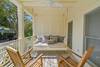 INCREDIBLE FURNISHED FRONT PORCH W/ BED SWING AND TWO ROCKING CH INCREDIBLE FURNISHED FRONT PORCH W/ BED SWING AND TWO ROCKING CH