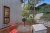 SIDE YARD AREA OF COTTAGE WITH OUTDOOR GRILL