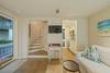 OPEN, COASTAL LIVING AREA UPON ENTRY W/ FLATSCREEN OPEN, COASTAL LIVING AREA UPON ENTRY W/ FLATSCREEN