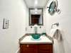 SINK IN HALLWAY TO LEFT OF FOYER