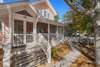 FRONT SCREENED PORCH AT ENTRANCE
