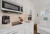 KITCHEN WITH INDUCTION STOVE, MICROWAVE, & COFFEE POT KITCHEN WITH INDUCTION STOVE, MICROWAVE, & COFFEE POT