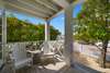 GENEROUS, PRIVATE FRONT PORCH WITH SEATING OVERLOOKING YARD