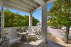 GENEROUS, PRIVATE FRONT PORCH WITH SEATING OVERLOOKING YARD GENEROUS, PRIVATE FRONT PORCH WITH SEATING OVERLOOKING YARD