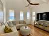 OPEN AIR LIVING WITH FLAT SCREEN TV AND BALCONY ACCESS