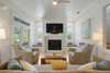 OPEN LIVING WITH SEATING FOR ALL AND FLATSCREEN TV