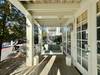 OPEN FRONT PORCH WITH CUSHIONED SWING AND SEATING OPEN FRONT PORCH WITH CUSHIONED SWING AND SEATING