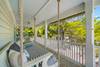 BALCONY WITH HANGING BED AND ADIRONDACK CHAIR SEATING BALCONY WITH HANGING BED AND ADIRONDACK CHAIR SEATING