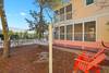 SIDE VIEW OF YARD WITH HAMMOCK AND TWO CHAIRS SIDE VIEW OF YARD WITH HAMMOCK AND TWO CHAIRS