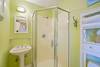 FOURTH BEDROOM HALL BATHROOM WITH SINGLE VANITY AND SHOWER FOURTH BEDROOM HALL BATHROOM WITH SINGLE VANITY AND SHOWER