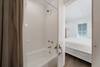 BATHROOM WITH TUB AND SHOWER BATHROOM WITH TUB AND SHOWER