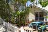 PRIVATE BACKYARD VIEW FROM FOOTPATH W OUTDOOR DINING