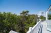 TOWN AND TREETOP VIEWS FROM WRAP AROUND BALCONY DECK