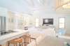 VIEW OF KITCHEN AND LIVING AREA FROM DINING