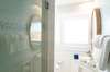 FULL BATH IN HALL W/ SINGLE VANITY AND GLASS ENCLOSED SHOWER