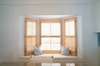 CUSHIONED WINDOW SEAT NEXT TO TASTEFUL DINING