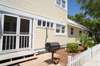 SIDE YARD WITH OUTDOOR GRILL AND SHOWER